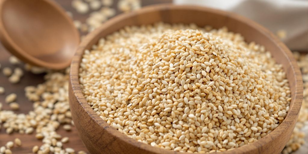 Psyllium husk in a bowl with a spoon.