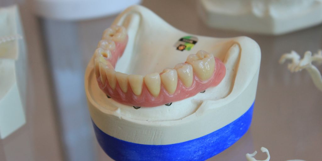 dentures on white scale rack